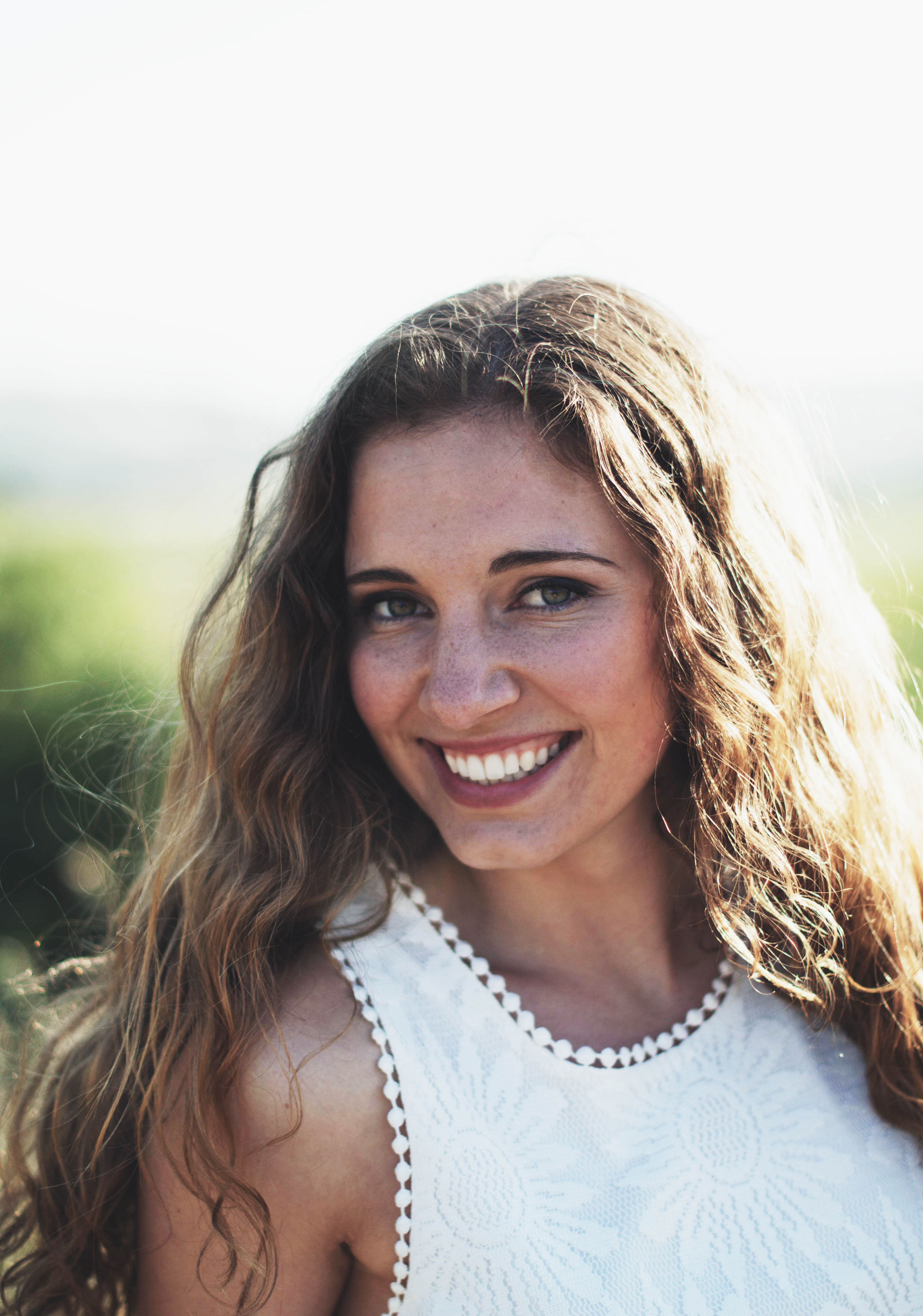 a young woman with long wavy hair